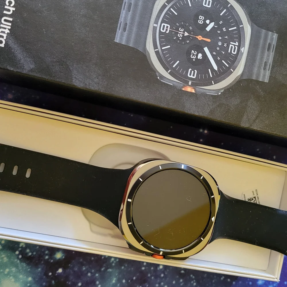 Samsung Smartwatch with Black Strap and Gold Bezel